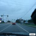 Suspicious men outside business in black Corolla