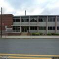 Person experiencing chest pain at Spring Grove business