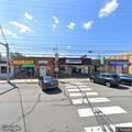 Disabled vehicle blocking road near laundromat
