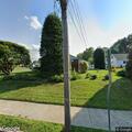 Officer handling fraud report at Platt Avenue home