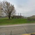 Downed utility line and pole in Chandlersville driveway