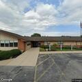 Person experiencing abdominal pain at apartment