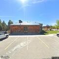 Woman having difficulty breathing at bank in Winter Park