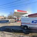 female complaining of knee pain at gas station