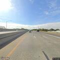 Person walking in traffic on highway center lane