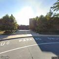 Woman running in street near apartment complex