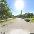 Officer checking silver Pontiac at Madison Park