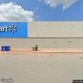 Young woman affected by substance in eyes at parking lot