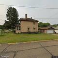 Caller reports ex damaged his home
