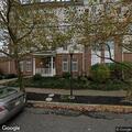 Person experiencing abdominal pain at apartment
