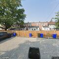 Suspicious person sleeping on bench at city park