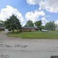 Person knocking on doors on North Harrison Street