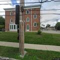 Agitated person yelling at bus stop near campus