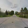 Vehicle stopped with doors open in roadway