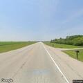 Large deer carcass blocking eastbound lane