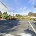 Downed power line blocking road and sidewalk