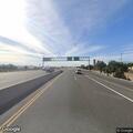 Pedestrian panhandling on shoulder of highway
