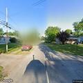 Person experiencing back pain on North Drexel Avenue