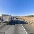 Person walking on I-85 with knife in hand