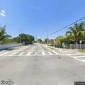 Cars drag racing near Northwest 17th Avenue