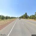 Person bleeding heavily in vehicle on highway in La Pine