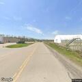 Person standing in roadway near Industrial Way