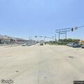 Male adult passed out in beige sedan at intersection