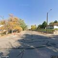 Person hiding beside trailer near 8th Street