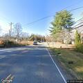 Car hits mailbox and is left by roadside