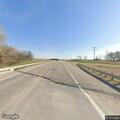 Deer struck and blocking highway traffic lane