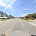 Truck hits pole and brings down power line on US 64