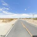 Person experiencing severe back pain in Lucerne Valley