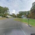 Officer picking up found item at Dogwood Lane