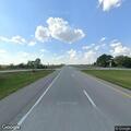 Semi truck with loose wind skirt on Highway 36