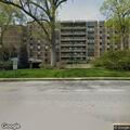 Person experiencing dizziness in apartment