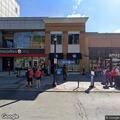 Person walking in middle of roadway on High Street