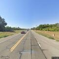 Reckless white sedan hitting guardrail on Highway 99