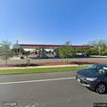 Person in car appears unresponsive near gas station