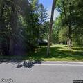 Motorcycle crash with possible leg injury and tree