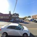 Complaint about woman and roosters behind auto shop