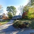 Person experiencing back pain at Devonwood Lane residence