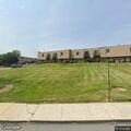 Person experiencing abdominal pain at apartment