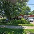 People in yard of vacant home on Walford Street