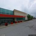 Vehicle hits light pole in store parking lot