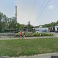 Traffic stop on red Toyota sedan at gas station