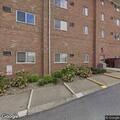Woman short of breath on bench near Bridgeport Manor