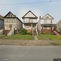 Suspicious person looking into basement windows