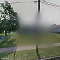 Person found lying in grass at human services building