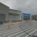 Teen female lying on ground at Walmart entrance