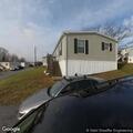 Person experiencing abdominal pain at mobile home park